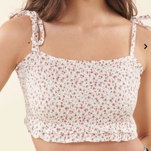 It is a floral cropped top from Garage.